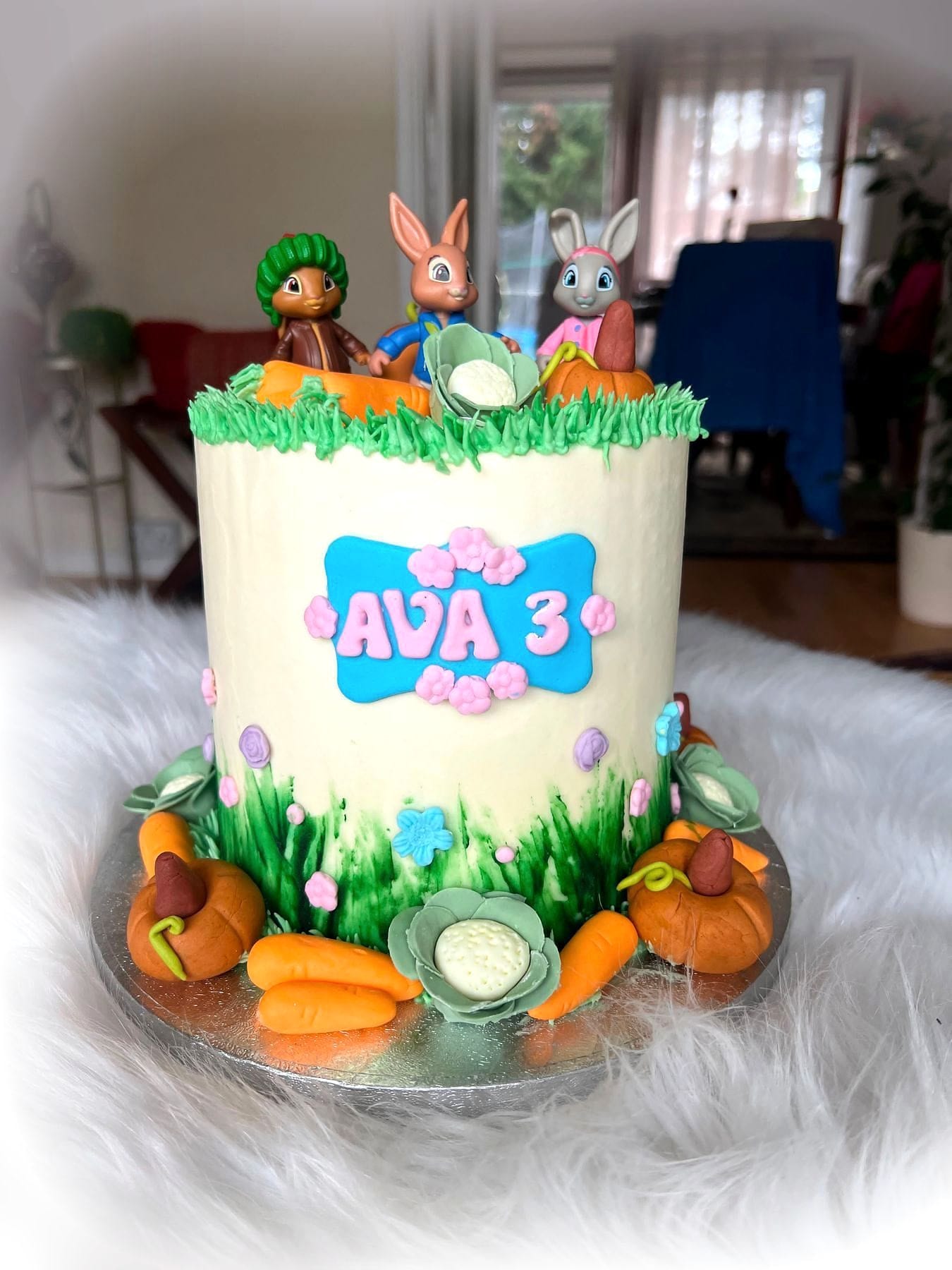 Garden Bunny Birthday Cake by SpongyBakes — A garden-themed cake with piped grass, fondant vegetables and bunny toppers.