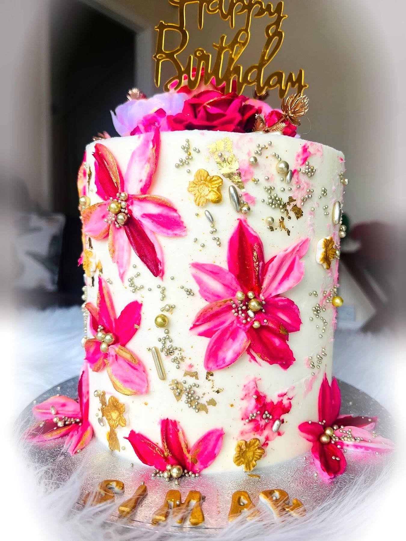 Pink Floral Birthday Cake by SpongyBakes — An ivory cake with hand-piped hot pink blooms, gold flecks and an acrylic topper.