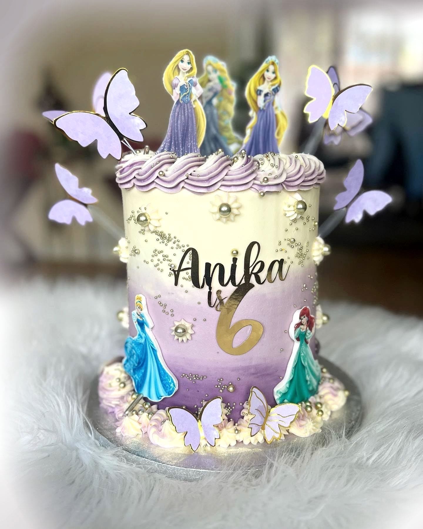 Princess Tower Birthday Cake by SpongyBakes — A lilac ombré cake with fondant butterflies, pearls and princess toppers.