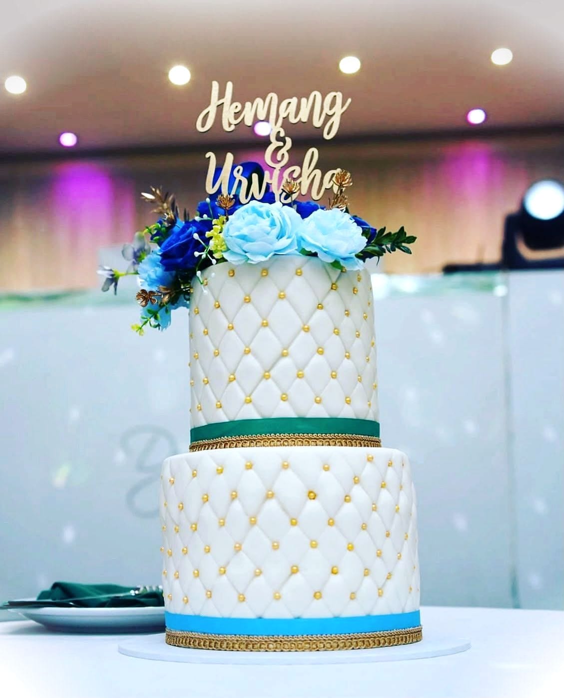 Quilted Ivory Wedding Cake by SpongyBakes — A two-tier quilted ivory cake with gold pearls and a fresh flower crown.