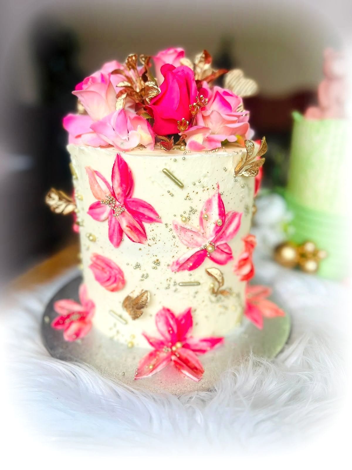 Blush Bloom Birthday Cake by SpongyBakes — A cream cake with hand-piped pink blooms, gold detailing and a fresh flower crown.