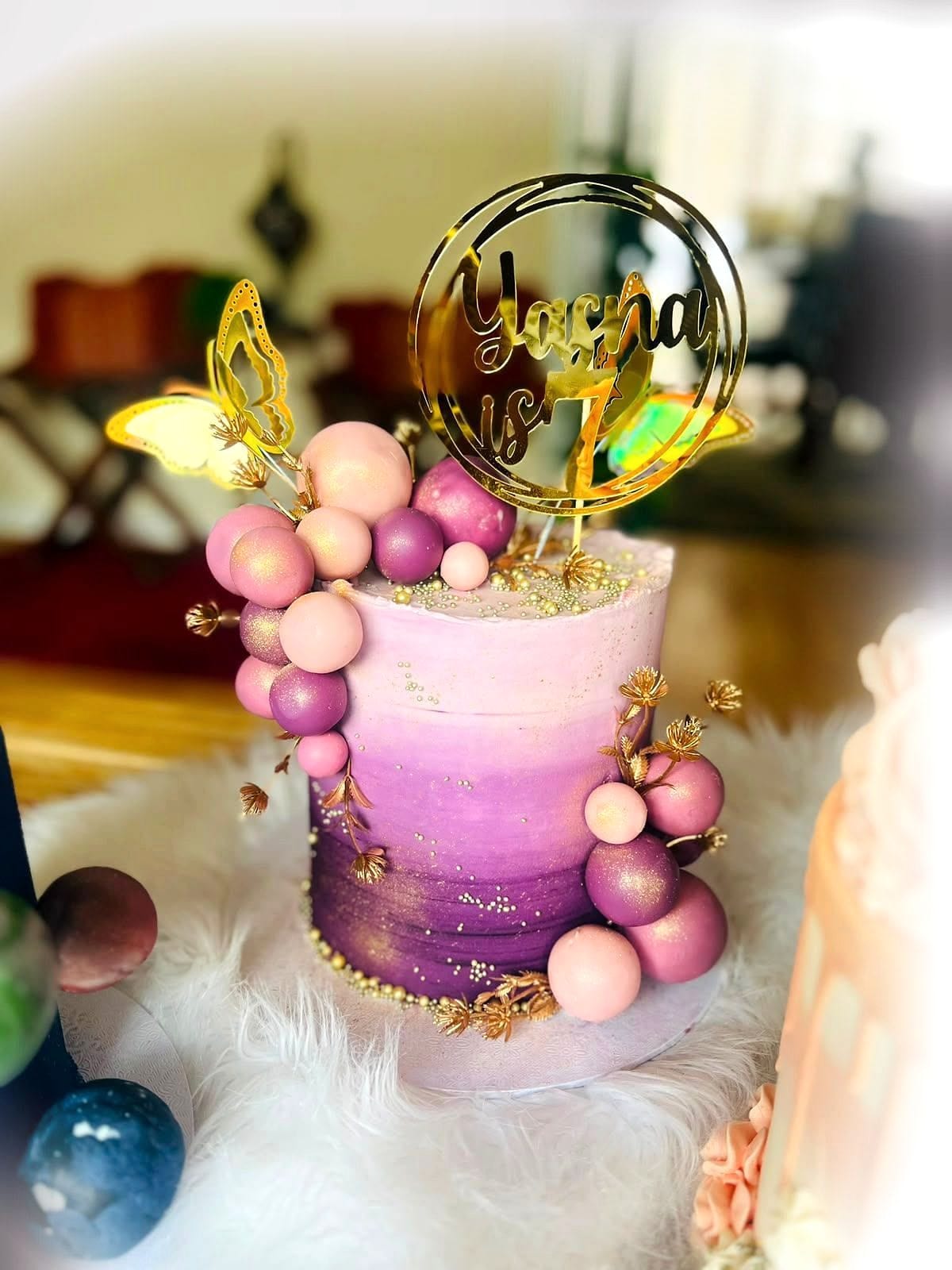 Pink & Purple Balloon Cake by SpongyBakes — A pink and purple ombré cake with a chocolate balloon cluster and gold topper.