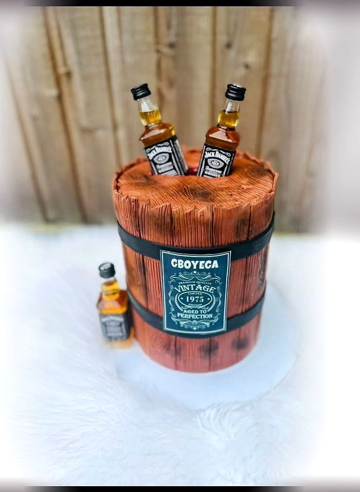 Whisky Barrel Celebration Cake by SpongyBakes — A sculpted barrel cake with hand-painted wood grain and miniature bottle toppers.