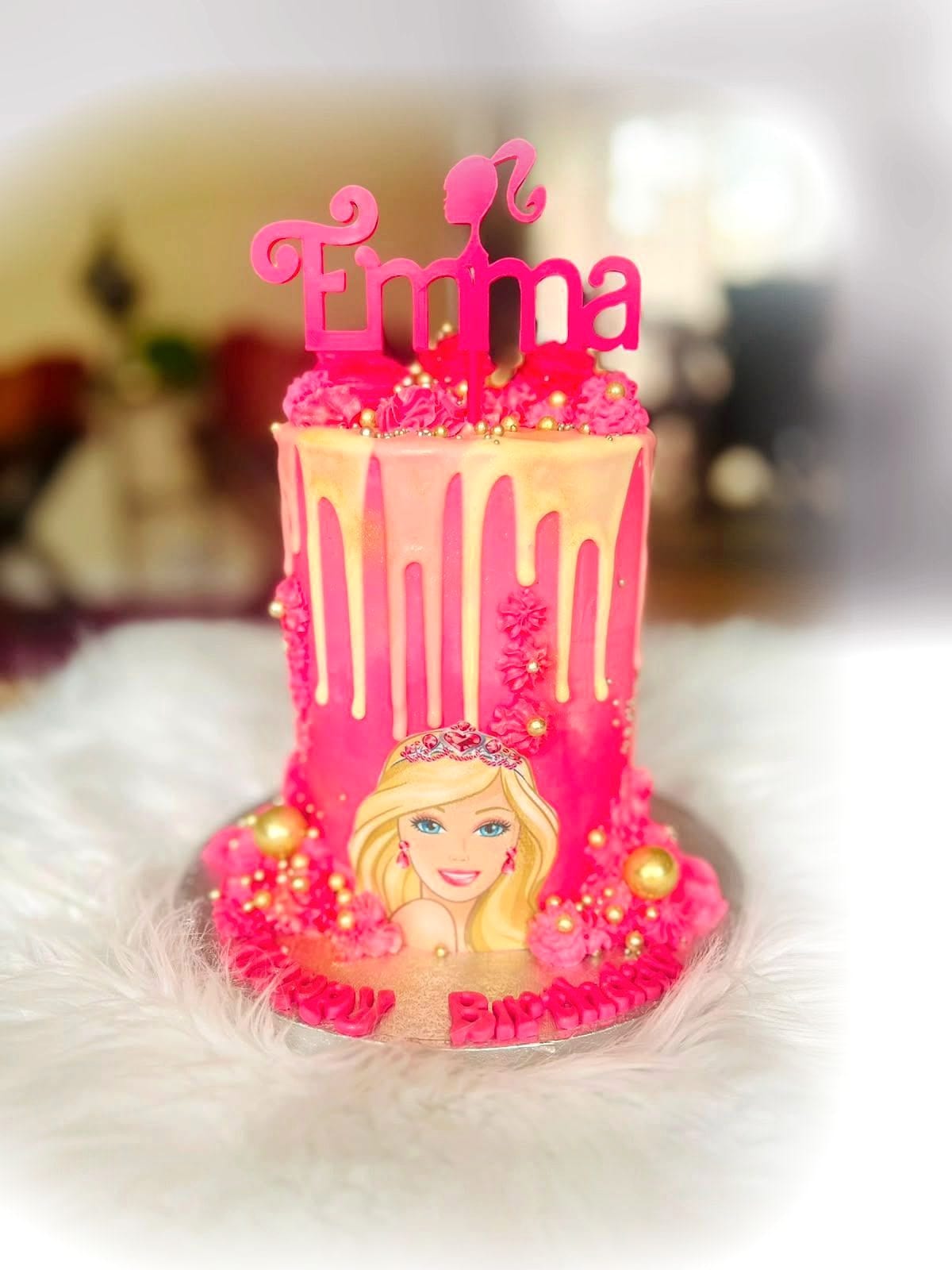 Pink Doll Drip Cake by SpongyBakes — A hot pink drip cake with gold spheres, a printed topper and an acrylic name.
