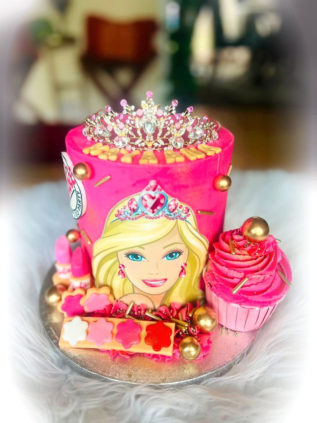 Pink Doll Tiara Cake by SpongyBakes — A vivid pink cake with a jewelled tiara, gold spheres and a printed topper.