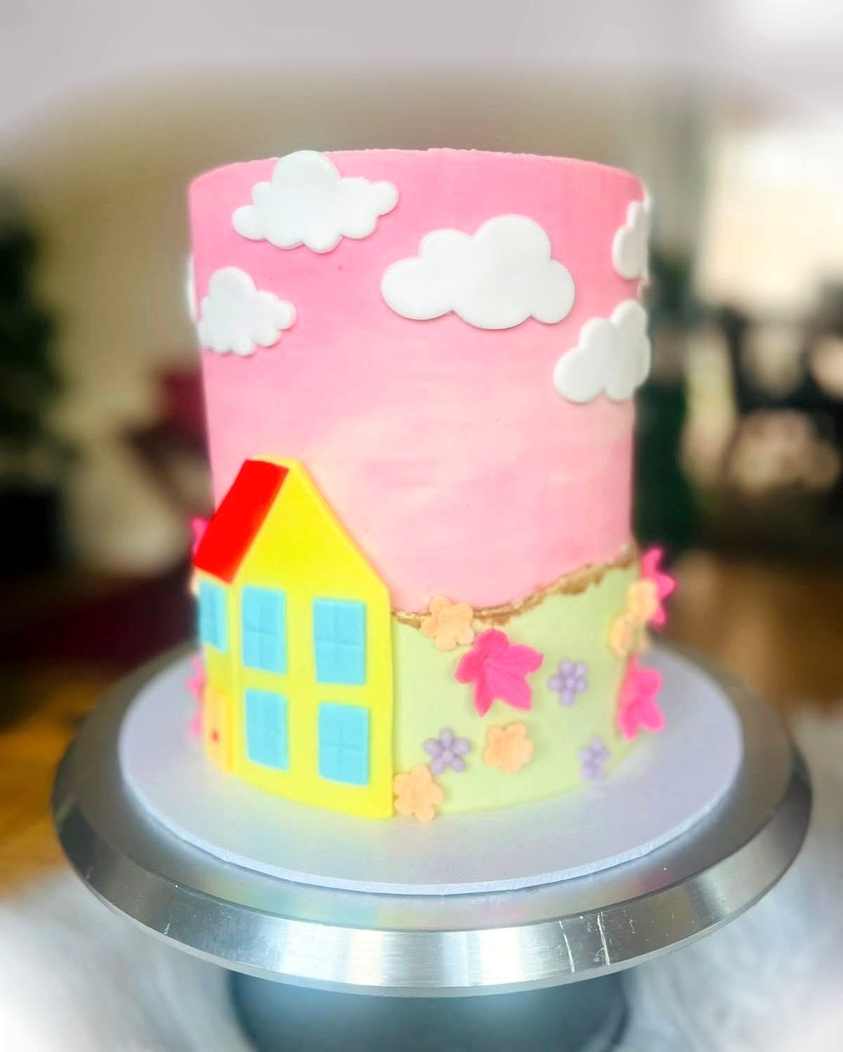 Little House Birthday Cake by SpongyBakes — A pink sky cake with fondant clouds, blossom and a hand-made cottage.